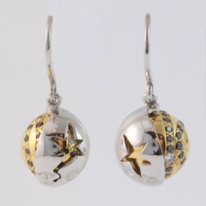 18 carat white and yellow gold 'Eclipse' hook earrings, set with black and white diamonds, with a rotating outer white gold shell