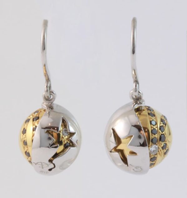 18 carat white and yellow gold 'Eclipse' hook earrings, set with black and white diamonds, with a rotating outer white gold shell