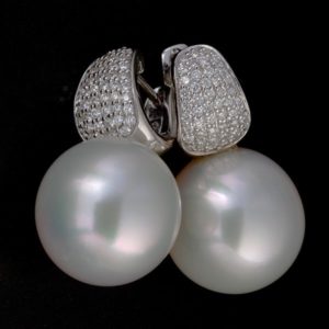 18 carat white gold South Sea pearl and pavè diamond earrings.