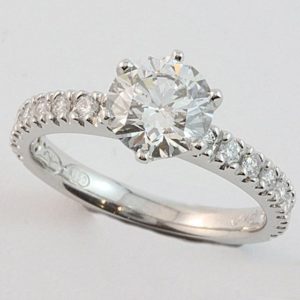 18 carat white gold claw set diamond engagement ring, set with a 1.30ct diamond and sixteen diamonds in the shoulders.