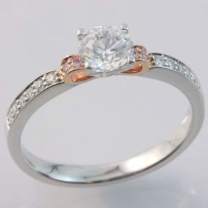 18 carat white and rose gold pink and white diamond ring.