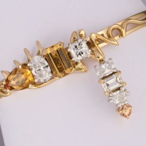 Topaz and diamond brooch with detachable pendant in 18 carat yellow and white gold