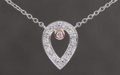 120297 : Two Tone Pear Shaped Pink & White Diamond Pendant