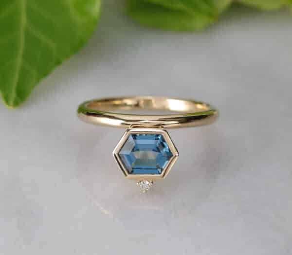 Abrecht Bird Jewellers, Abrecht Bird, blue topaz, diamond, geometric ring, yellow gold, bezel set, claw set, off centre ring,